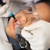 Zyris Isolite Pro System with posterior mouthpiece on child patient during sealant procedure..